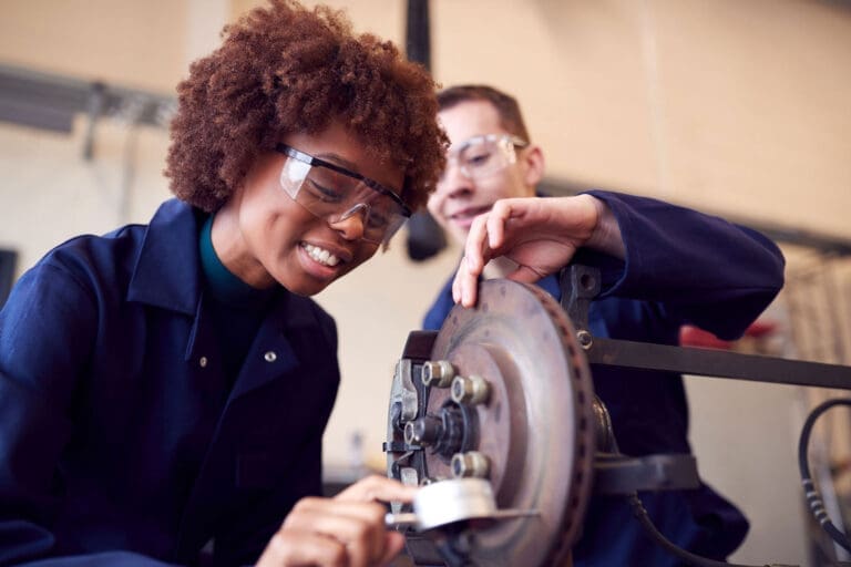 Student being shown a machine
