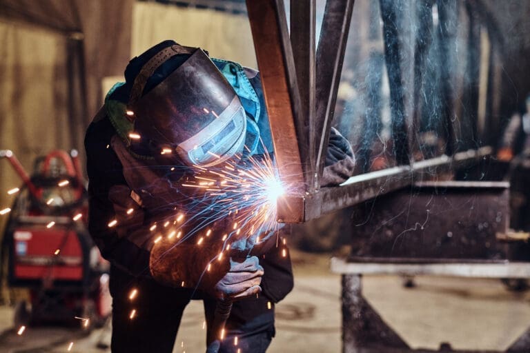 Man working at metal factory